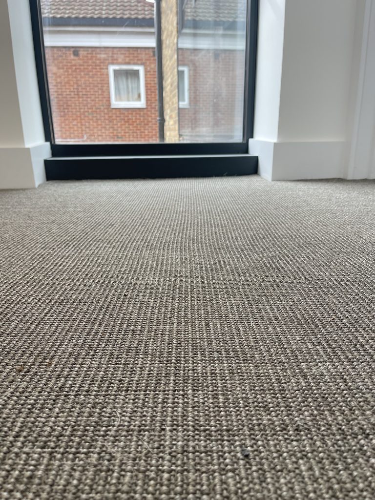 Close-up detail of sisal carpet weave and texture