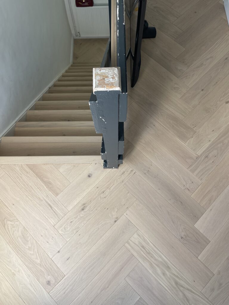 Completed herringbone engineered wood flooring installation, South West London