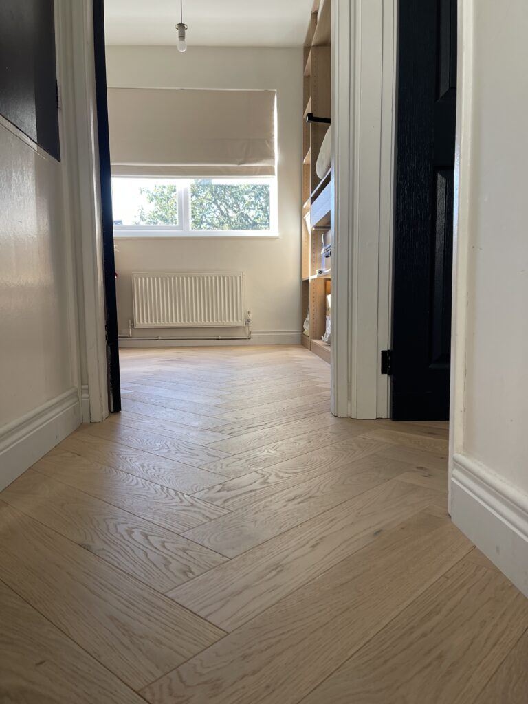 Completed herringbone engineered wood flooring installation, South West London