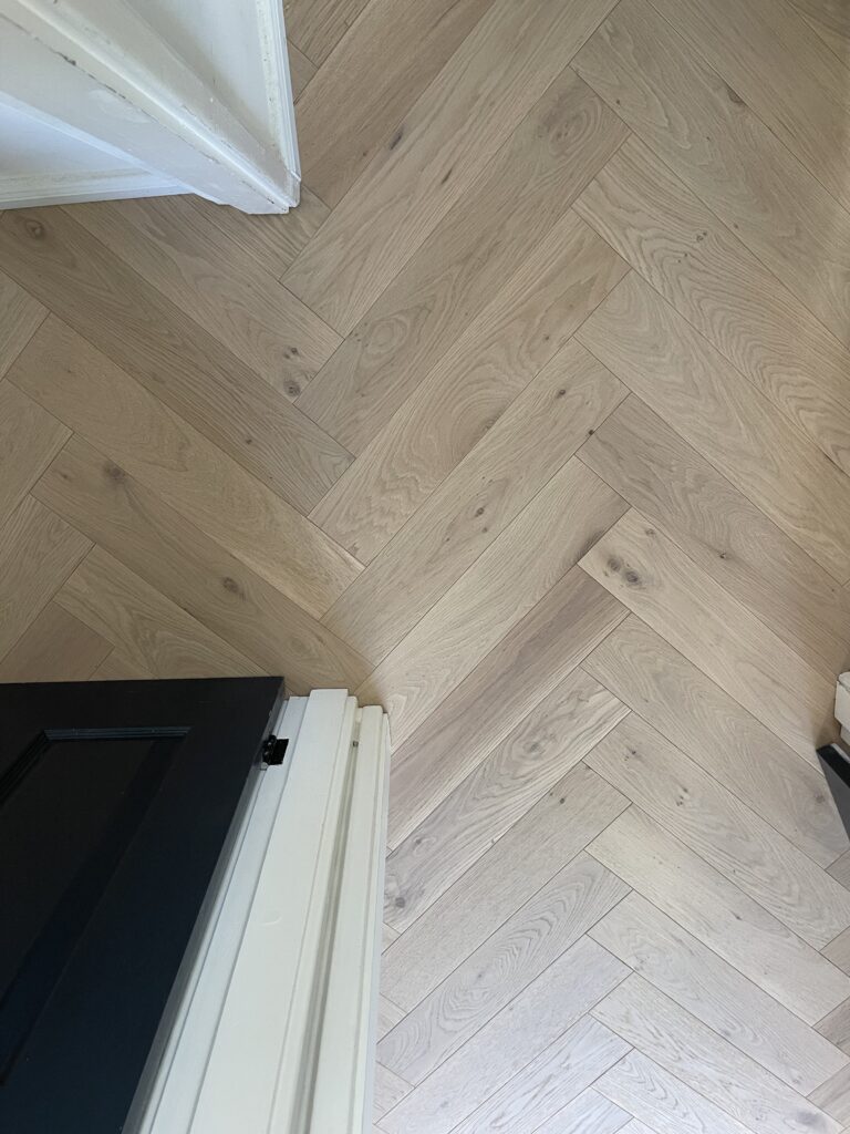 Completed herringbone wood flooring installation, South West London